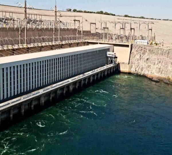 Water flowing beside the hydroelectric power station and electrical installations at the Aswan High Dam