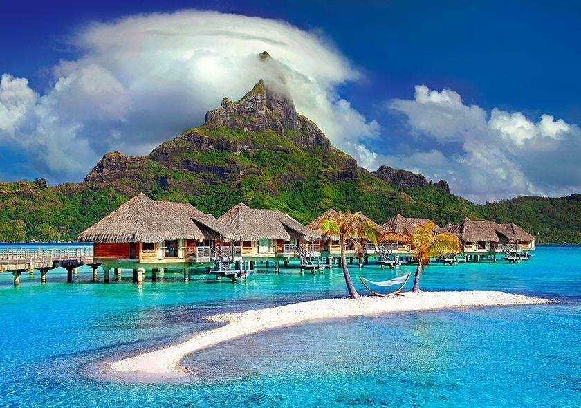 Overwater bungalows beside a tropical island